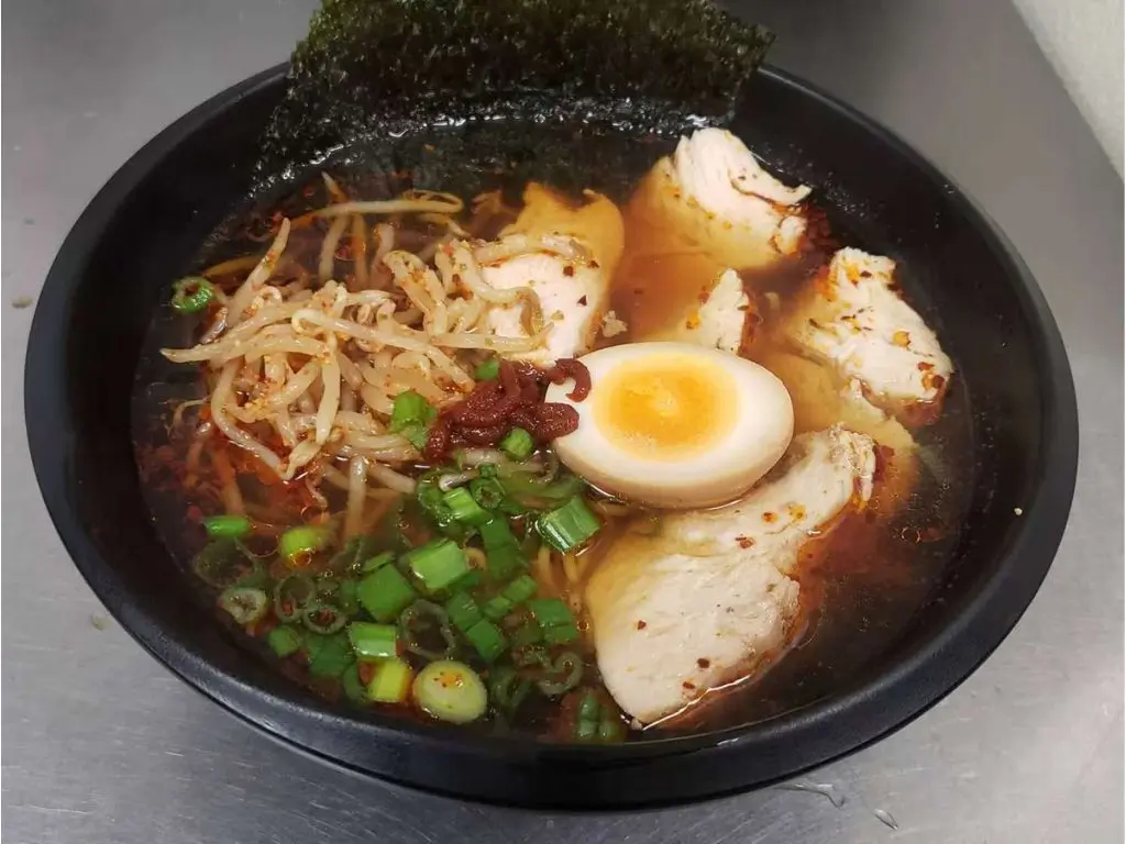 Ramen soup with tender chicken, soft - boiled egg, bean sprouts, scallions at Luv Ramen & BBQ, a Japanese restaurant in Hawthorne