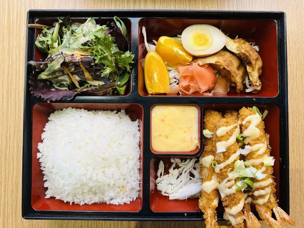 Luv-Ramen-&-BBQ-Japanese-restaurant-Tempura-Shrimp-Bento-Hawthorne Bento with tempura shrimp, white rice, mixed greens salad, orange slices, potstickers at Luv Ramen & BBQ, a Japanese restaurant in Hawthorne