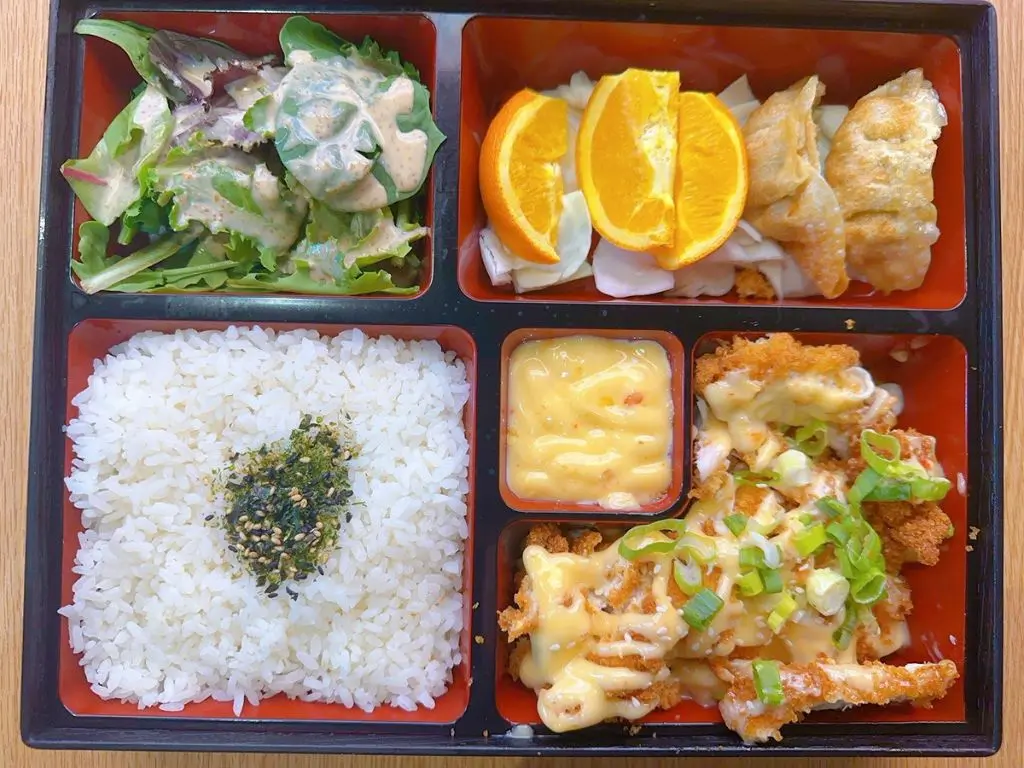 Luv-Ramen-&-BBQ-Japanese-restaurant-Katsu-Chicken-Bento-Hawthorne Bento with katsu chicken, white rice (topped with furikake), mixed greens salad, orange slices, potstickers at Luv Ramen & BBQ, a Japanese restaurant in Hawthorne